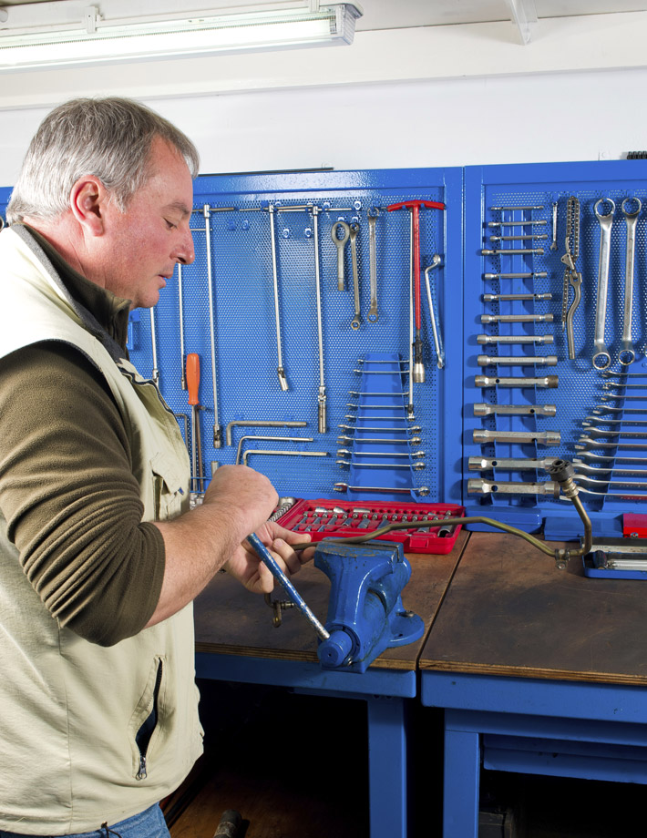 Man Working at Workbench